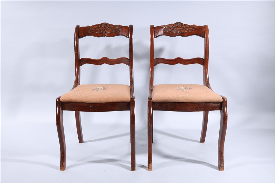 Pair of vintage carved wood chairs;