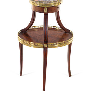 A Louis XV/XVI Two Tiered Mahogany Table