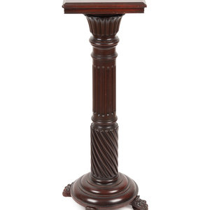 A Carved Mahogany Pedestal
Late
