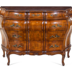 An Italian Walnut Bombe Commode
Early