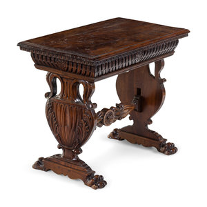 A Renaissance Revival Carved Walnut