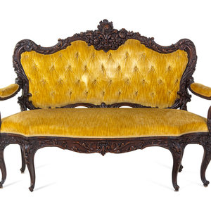 A Rococo Revival Carved Walnut