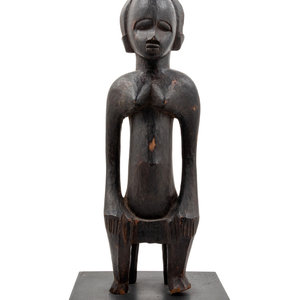 A Senufo Style Carved Wood Figure
Mid-20th