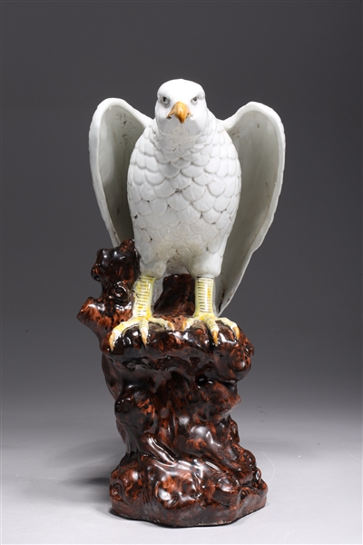 Chinese porcelain hawk atop rock formation
