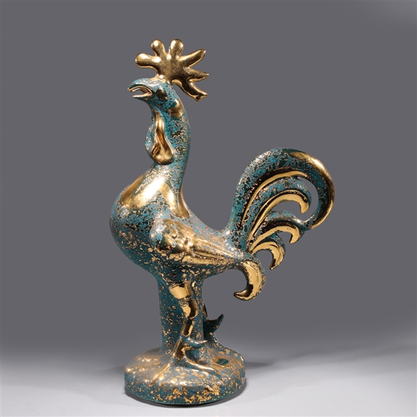 Gold and teal sculpture of a rooster,
