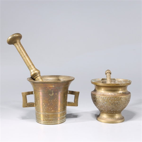 Two antique Indian brass mortars and