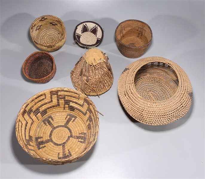 Seven assorted vintage woven baskets