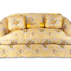 An Upholstered Loveseat with Three Cushions
21ST