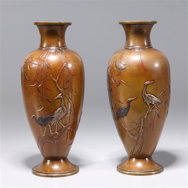 Pair of antique metal vases with birds,