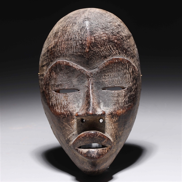 Carved wooden mask in the style 2ac151