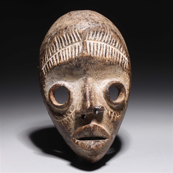 Carved wooden mask in the style 2ac152