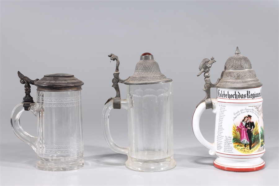 Three German beer steins, each with