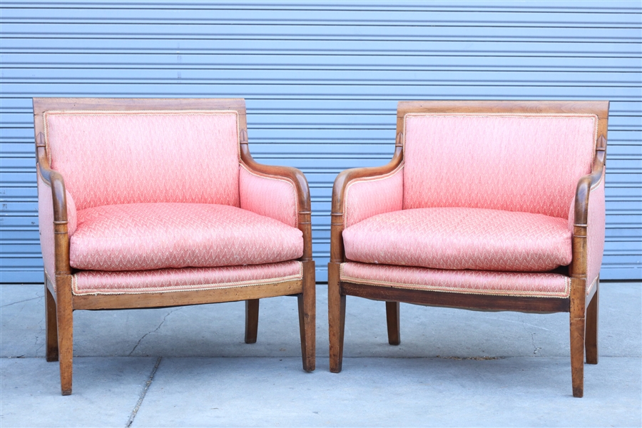 Pair of upholstered wood armchairs;