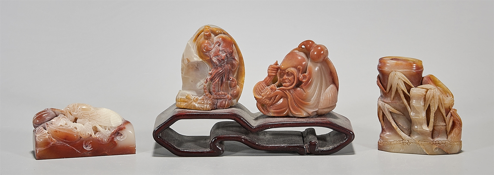 Four Chinese soapstone carvings;