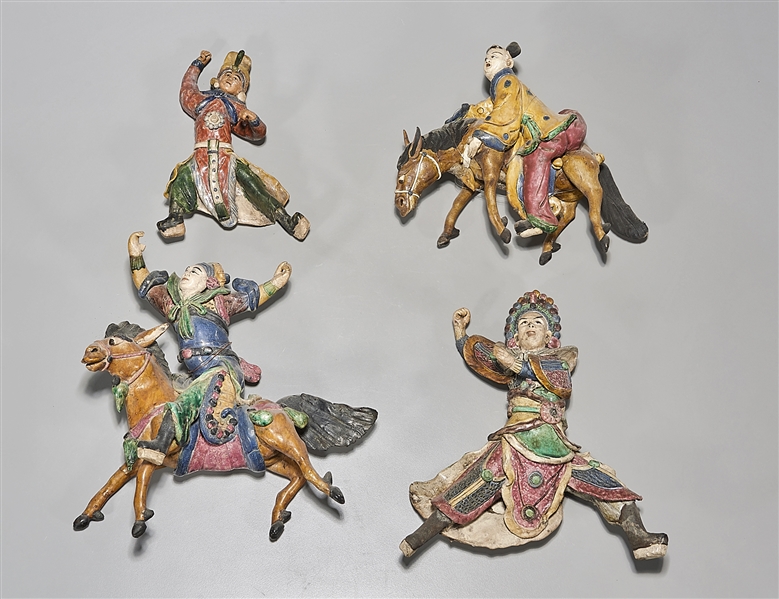 Four Japanese roof tile figures;