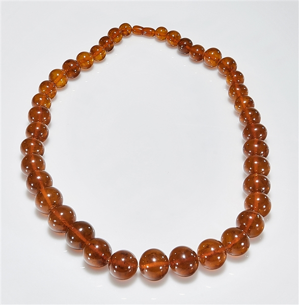 Large amber or copal bead necklace;