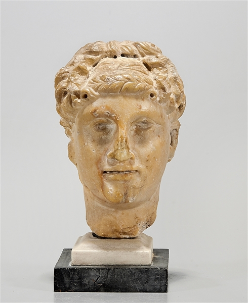 Roman marble head of man on stone