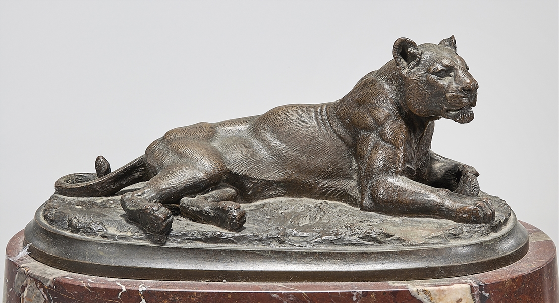 Cast metal sculpture of a cougar, signed