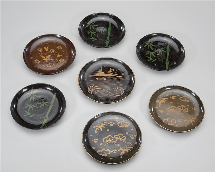 Seven Japanese lacquer plates; bamboo