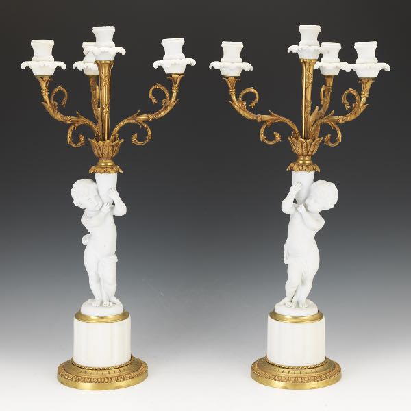 BISQUE PORCELAIN AND GILT CANDELABRAS