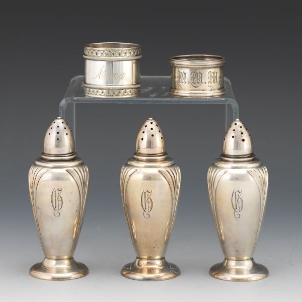 THREE SALT SHAKERS AND TWO NAPKIN RINGS