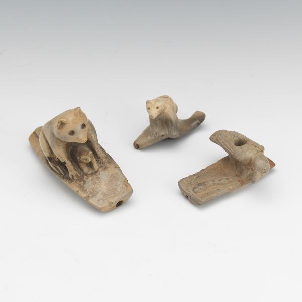 THREE CARVED EFFIGY PIPES  Three