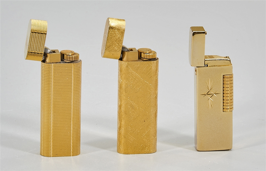 Three vintage lighters; including two