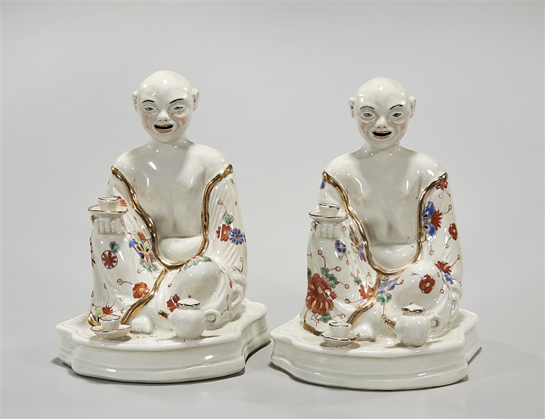 Two Chinese porcelain seated figures;