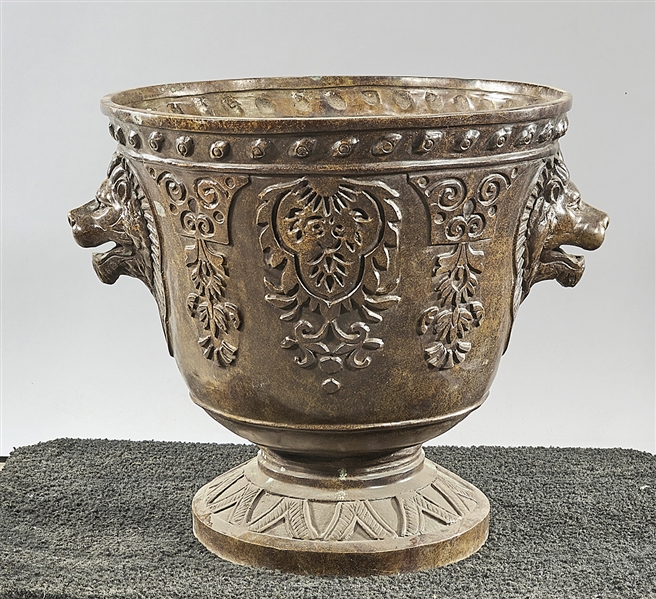 Bronze jardiniere with lion head handles;