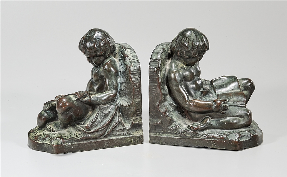 Pair of bronze bookends of seated 2ae659