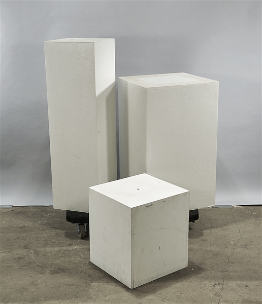 Three white pedestals; 40" x 12