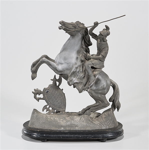 Metal sculpture of a man with spear,