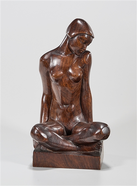 Carved wood sculpture of a seated 2aeaaf