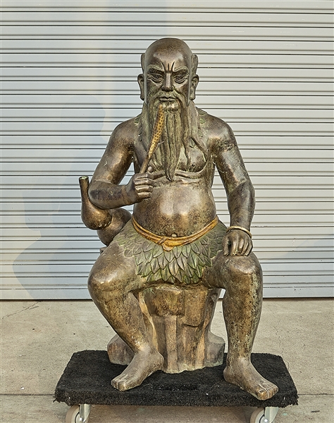 Chinese bronze seated figure; holding