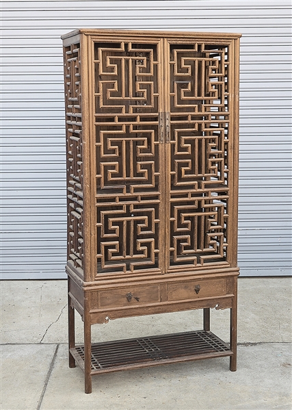 Chinese two piece wood cabinet; consisting