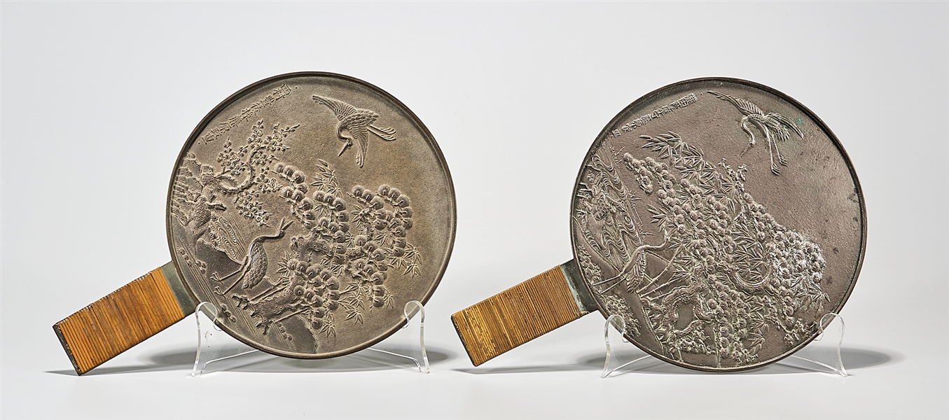 Two antique Japanese bronze hand