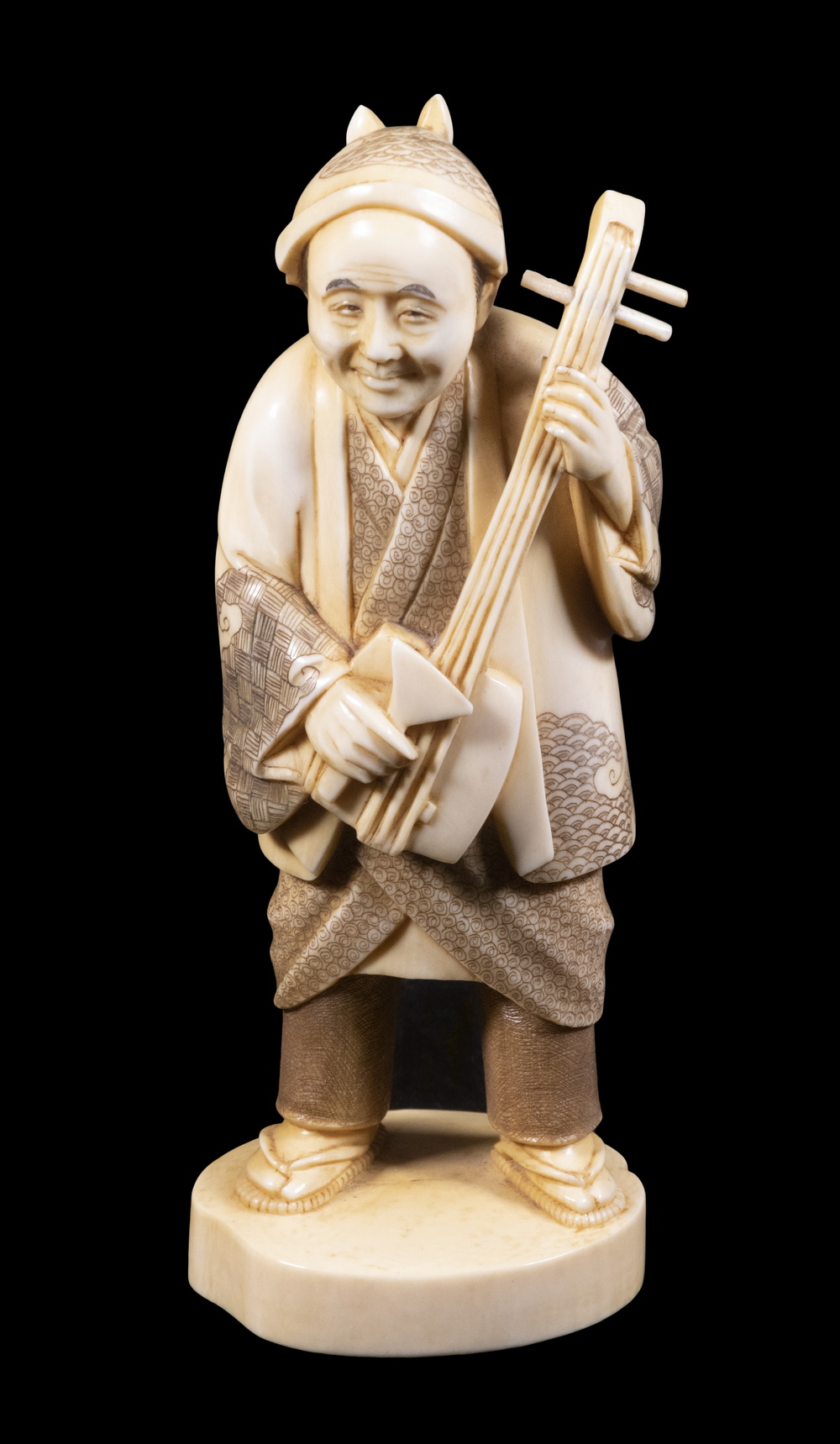 19TH C. IVORY OKIMONO OF A STANDING