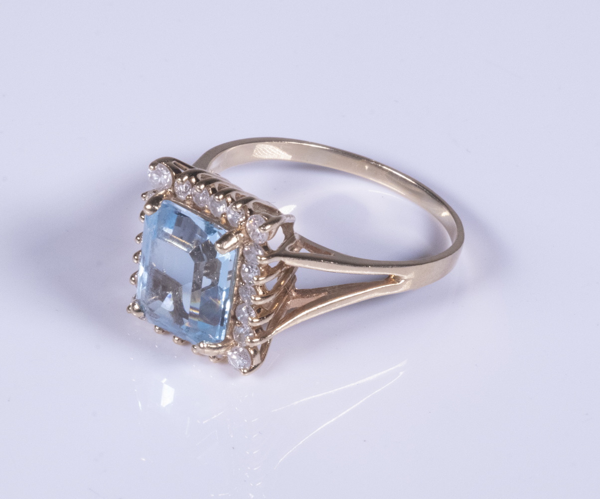 LADIES BLUE TOPAZ AND DIAMOND RING