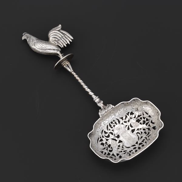 A LARGE DUTCH SILVER STRAINER SPOON