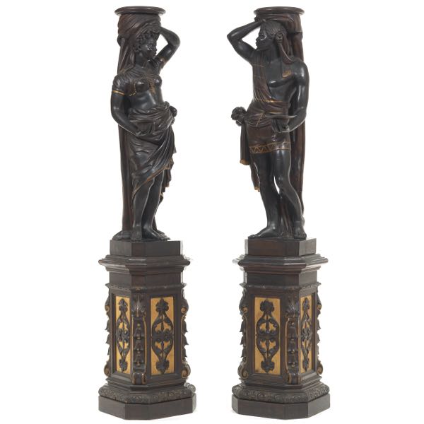 TWO IMPRESSIVE CARVED EBONIZED AND GILT