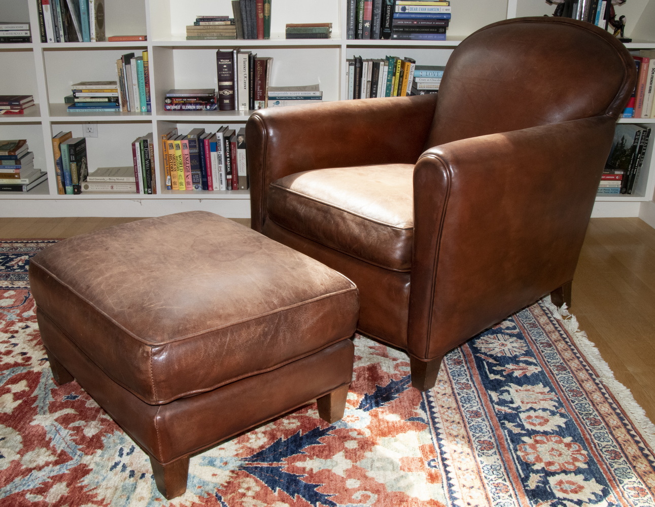 BROWN LEATHER ARMCHAIR WITH OTTOMAN