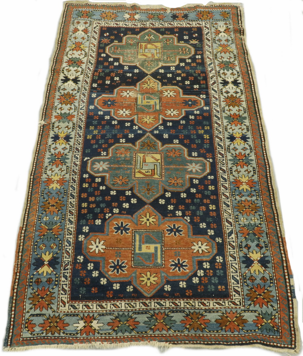 KAZAK RUG Column of four 'cruciform'