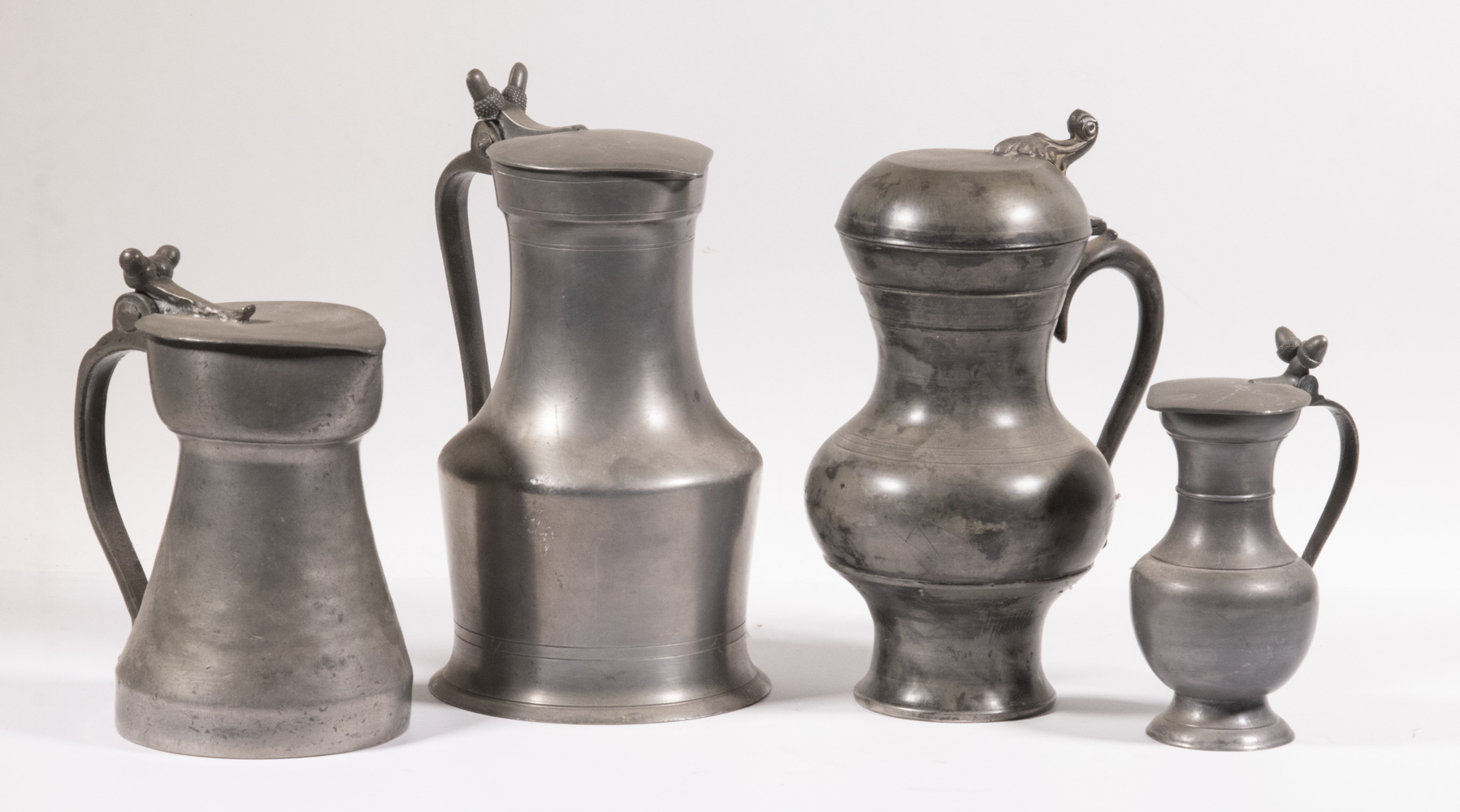 PEWTER FLAGONS Group of (4) 19th c.