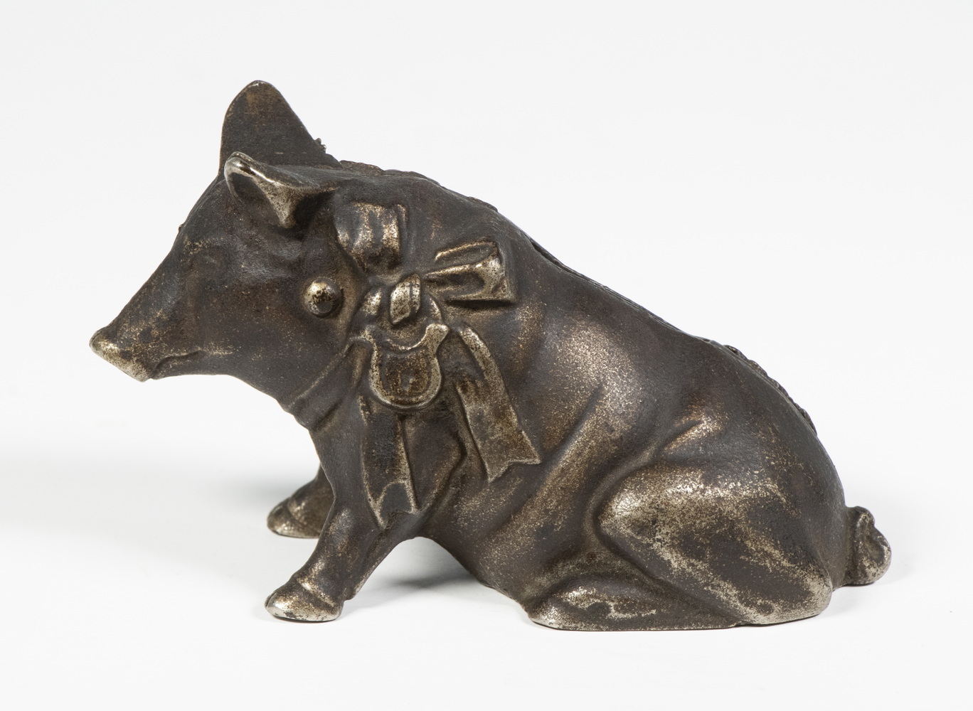 CAST IRON SEATED PIG WITH BOW BANK