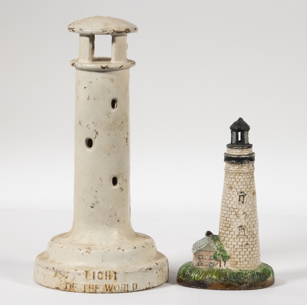  2 CAST IRON LIGHTHOUSE FORM STILL 2b3591