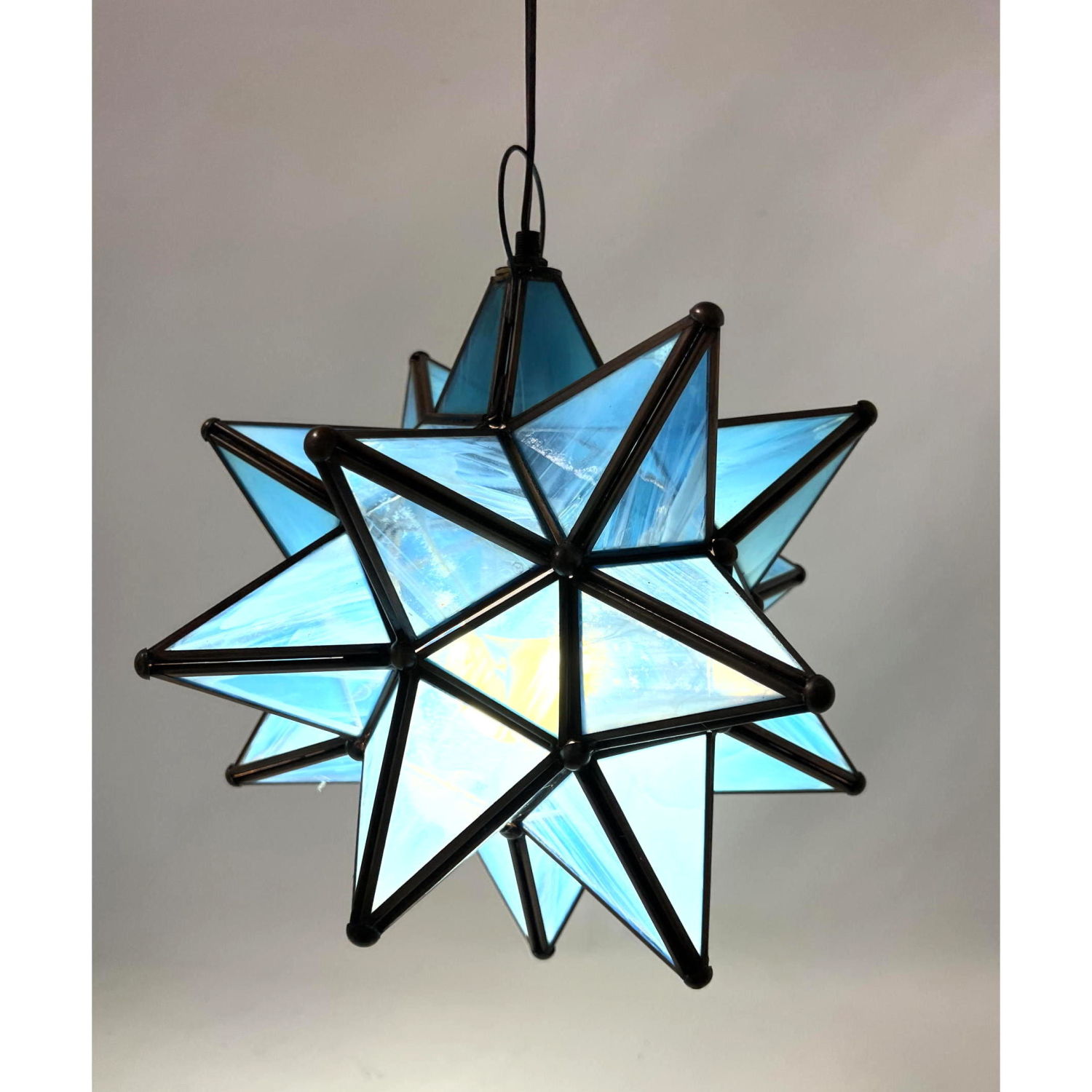 Blue glass star form pendant lamp.
