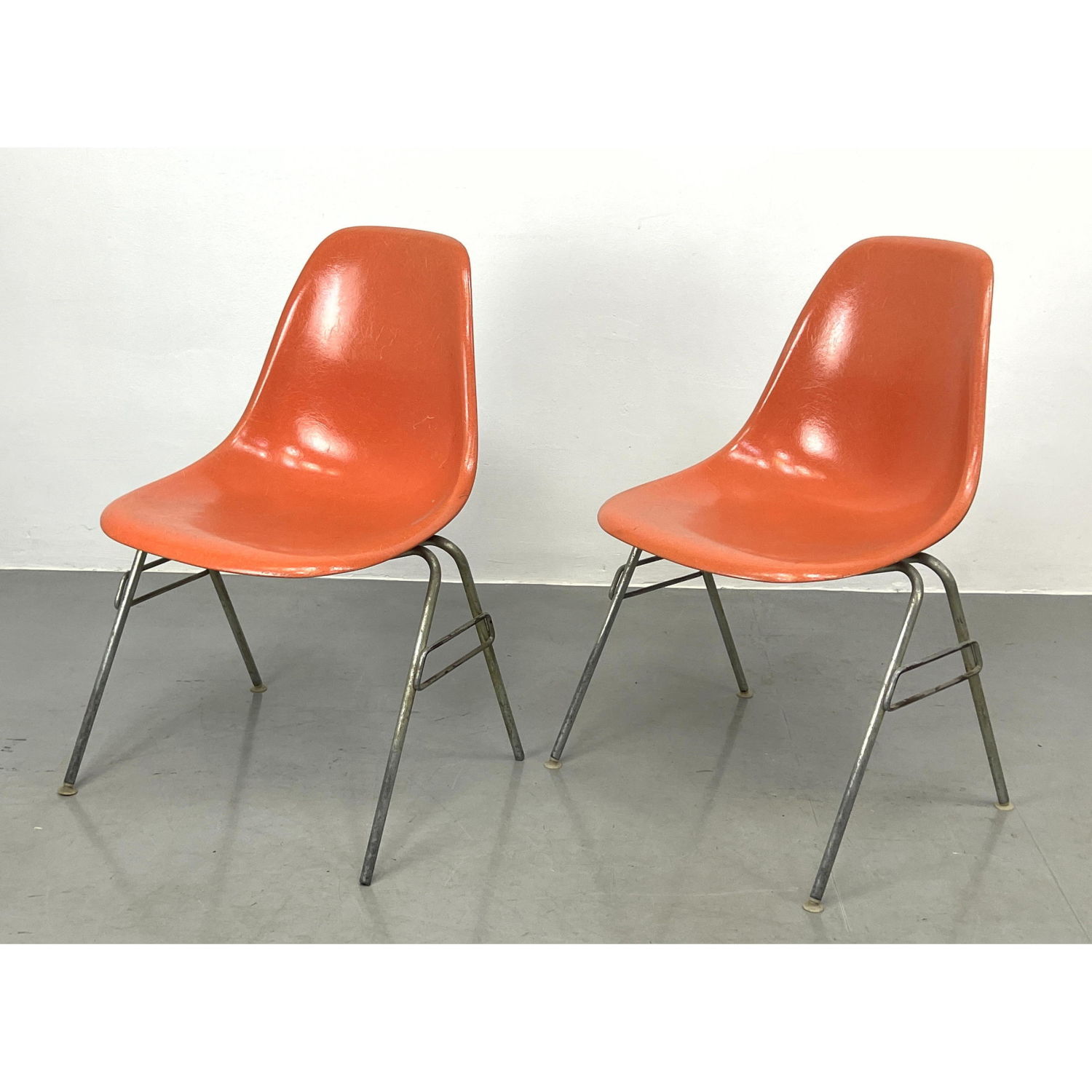 Pr Orange Eames shell chairs Herman