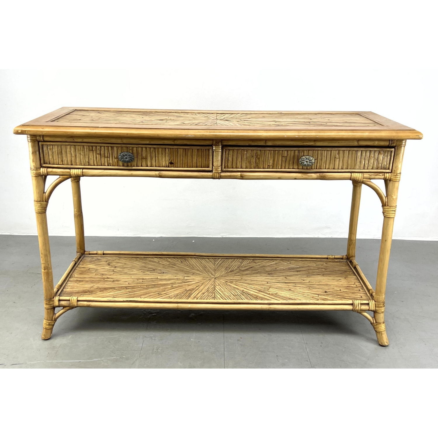 Rattan console table with two drawers.