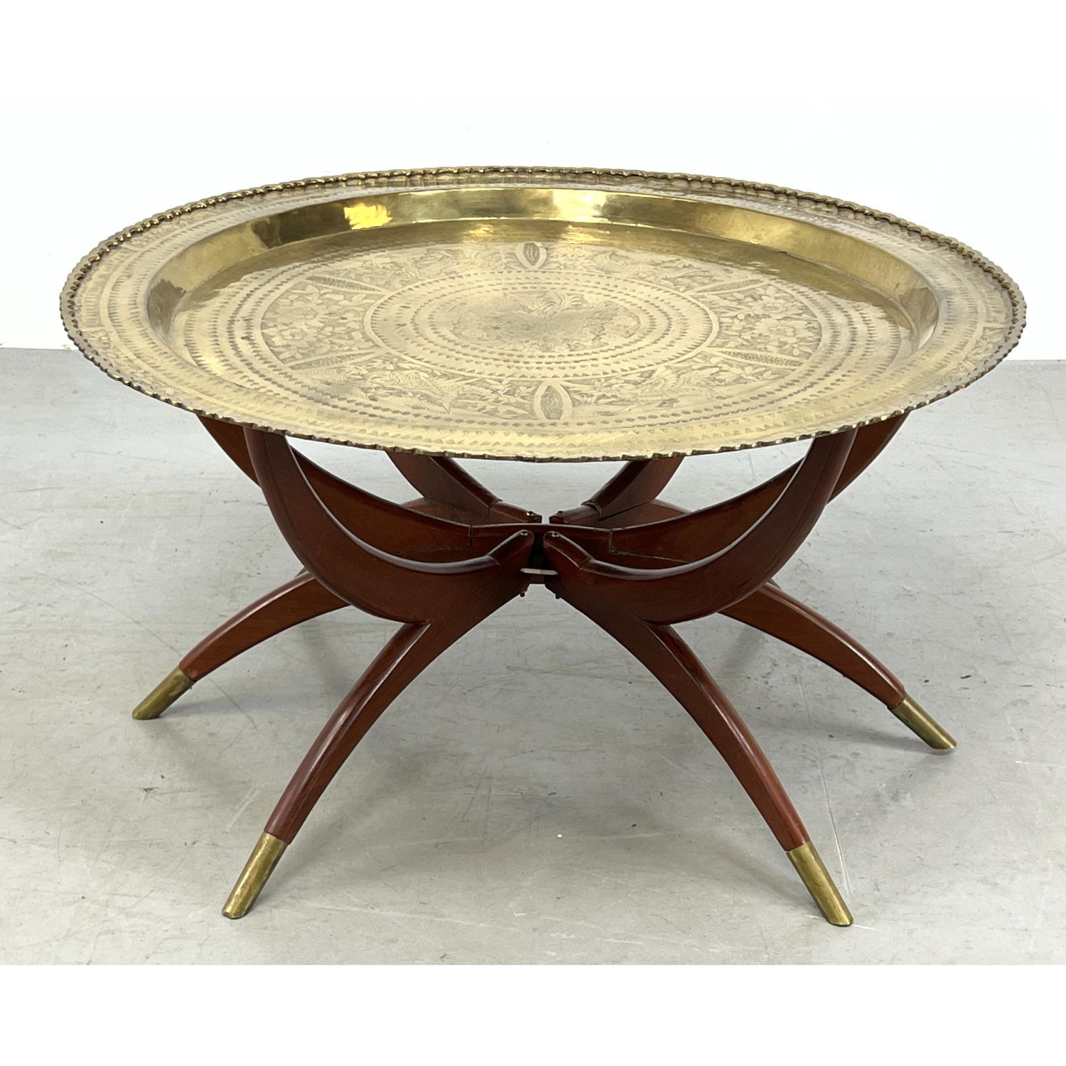 Round brass coffee tray table on