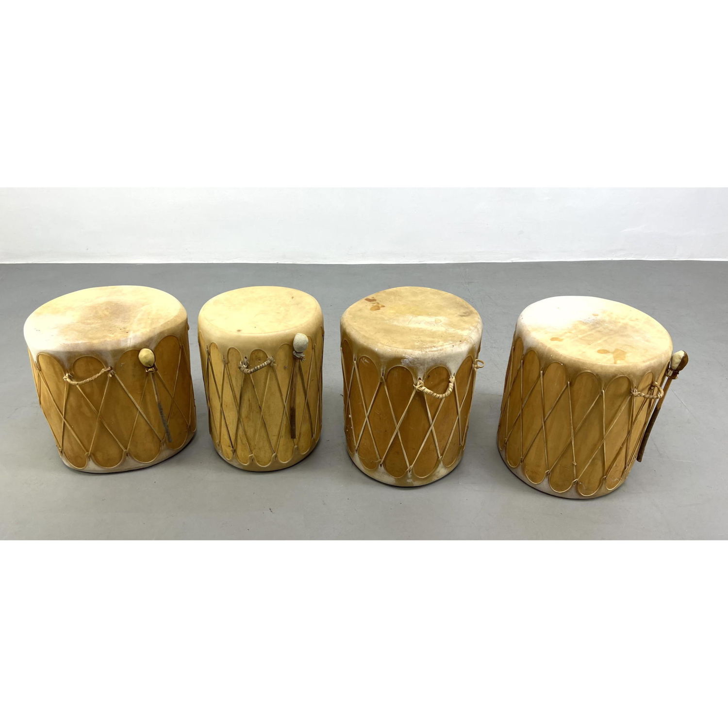 4 tribal drums with stretched hide.